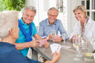 Friends playing card games at table